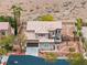 An aerial view of the desert home, including the desert landscaping, and private yard at 7756 River Mist Ct, Las Vegas, NV 89113
