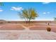 Spacious backyard features a patio, desert landscaping, and privacy wall, perfect for relaxing or entertaining guests at 7756 River Mist Ct, Las Vegas, NV 89113