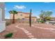 Landscaped backyard featuring a cacti and desert landscaping with a stone path circling the perimeter at 7756 River Mist Ct, Las Vegas, NV 89113