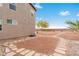 Expansive backyard featuring desert landscaping, a view of the surrounding hills, and a stone pathway at 7756 River Mist Ct, Las Vegas, NV 89113