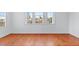 Bright bedroom with hardwood floors and a view of neighborhood at 7756 River Mist Ct, Las Vegas, NV 89113