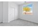 Cozy bedroom with carpet and a window at 7756 River Mist Ct, Las Vegas, NV 89113