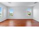 Spacious bedroom featuring hardwood floors and natural light at 7756 River Mist Ct, Las Vegas, NV 89113