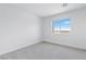 Bedroom with carpet flooring, a window with a view, and neutral paint at 7756 River Mist Ct, Las Vegas, NV 89113
