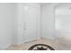 Bright entryway with marble floors, a white front door and a decorative floor inlay at 7756 River Mist Ct, Las Vegas, NV 89113