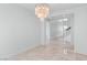 Spacious hallway features tiled floors and staircase leading to the second floor at 7756 River Mist Ct, Las Vegas, NV 89113