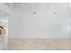 Minimalist living area with light marble floors, and natural light at 7756 River Mist Ct, Las Vegas, NV 89113