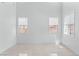 Bright living room with neutral color palette, and a view of the front yard at 7756 River Mist Ct, Las Vegas, NV 89113