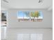 Bright living room with a door and tile floors at 7756 River Mist Ct, Las Vegas, NV 89113
