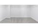 Spacious walk-in closet with neutral carpet and wire shelving for ample storage at 7756 River Mist Ct, Las Vegas, NV 89113