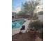 Backyard view of the pool and decorative landscaping for outdoor enjoyment at 7894 W Patrick Ln, Las Vegas, NV 89113