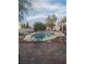 Backyard includes a pool, seating, patio, and privacy landscaping at 7894 W Patrick Ln, Las Vegas, NV 89113