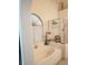 Bathroom featuring a tub with tiled surround, and a glass-doored shower at 7894 W Patrick Ln, Las Vegas, NV 89113