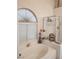 Bright bathroom featuring a tub with tiled surround, and a glass-doored shower at 7894 W Patrick Ln, Las Vegas, NV 89113
