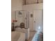 Bright bathroom featuring a tub and a glass-enclosed shower stall at 7894 W Patrick Ln, Las Vegas, NV 89113