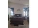 Bright bedroom boasting a sleigh bed, high ceilings, and decorative wall accents at 7894 W Patrick Ln, Las Vegas, NV 89113
