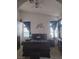 View of the primary bedroom featuring vaulted ceiling, dark furniture, and ample natural light at 7894 W Patrick Ln, Las Vegas, NV 89113