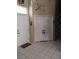 Inviting foyer with double doors, white tile flooring, and a decorative wall design at 7894 W Patrick Ln, Las Vegas, NV 89113