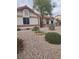 Charming single-story home featuring low maintenance desert landscaping at 7894 W Patrick Ln, Las Vegas, NV 89113