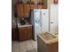 Practical kitchen with ample cabinet space, a refrigerator, and tile flooring at 7894 W Patrick Ln, Las Vegas, NV 89113