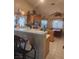 Functional kitchen featuring a breakfast bar, lots of storage and a casual dining area at 7894 W Patrick Ln, Las Vegas, NV 89113