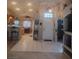 Open living area flowing into the kitchen, featuring tile floors and a comfortable layout at 7894 W Patrick Ln, Las Vegas, NV 89113