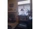 Living room featuring a fireplace, mantle decorations, and large window at 7894 W Patrick Ln, Las Vegas, NV 89113