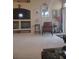 Living room with a built in TV console, decorations on the wall, and a brown chair at 7894 W Patrick Ln, Las Vegas, NV 89113