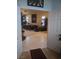 An open doorway leads to a living room with tile and carpet flooring at 7894 W Patrick Ln, Las Vegas, NV 89113