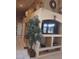 Living room with a built in TV console, decorations on the wall, and a plant at 7894 W Patrick Ln, Las Vegas, NV 89113
