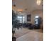 Bright living room with vaulted ceilings, large windows, and comfortable seating arrangements at 7894 W Patrick Ln, Las Vegas, NV 89113