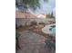 Backyard includes a patio, pool, seating, and drought-resistant landscaping at 7894 W Patrick Ln, Las Vegas, NV 89113