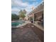 Backyard with a private pool, patio, and pergola for outdoor relaxation and entertainment at 7894 W Patrick Ln, Las Vegas, NV 89113