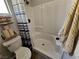 Bathroom featuring a shower with blue-striped curtain and toilet at 8072 Cimarron Ridge Dr # 201, Las Vegas, NV 89128