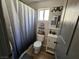 Bathroom with modern fixtures, including a sink, toilet, and shower with sleek black hardware at 8072 Cimarron Ridge Dr # 201, Las Vegas, NV 89128