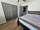 Bedroom with a ceiling fan, a closet with sliding doors, and a dark wooden bed frame at 8072 Cimarron Ridge Dr # 201, Las Vegas, NV 89128