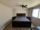 Cozy bedroom with hardwood floors, ceiling fan, and natural light at 8072 Cimarron Ridge Dr # 201, Las Vegas, NV 89128