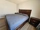 Bedroom features hardwood floors and ample natural light from the window at 8072 Cimarron Ridge Dr # 201, Las Vegas, NV 89128