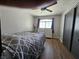 Bedroom boasts a bed, dresser, ceiling fan, and a bright window with nice curtains at 8072 Cimarron Ridge Dr # 201, Las Vegas, NV 89128