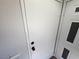 White front door with black door knob at 8072 Cimarron Ridge Dr # 201, Las Vegas, NV 89128