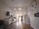 A clean, modern kitchen boasts white cabinets and stainless steel appliances in an open floorplan at 8072 Cimarron Ridge Dr # 201, Las Vegas, NV 89128