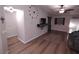 A spacious living room with contemporary decor, modern light fixture and open access to other spaces at 8072 Cimarron Ridge Dr # 201, Las Vegas, NV 89128