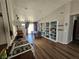 Bright open living room with wood floors and custom shelving near the dining area at 8072 Cimarron Ridge Dr # 201, Las Vegas, NV 89128