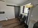 Cozy living room featuring a sliding barn door and two comfortable chairs by the window at 8072 Cimarron Ridge Dr # 201, Las Vegas, NV 89128