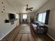Cozy living room featuring modern decor, a ceiling fan, and comfortable seating arrangement at 8072 Cimarron Ridge Dr # 201, Las Vegas, NV 89128