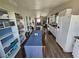 Spacious living area featuring built-in shelves, wood floors, and natural light at 8072 Cimarron Ridge Dr # 201, Las Vegas, NV 89128