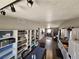 Open-concept living and dining area, featuring wood floors and bright recessed lighting at 8072 Cimarron Ridge Dr # 201, Las Vegas, NV 89128