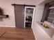 Home office space featuring a sliding barn door and built-in shelving at 8072 Cimarron Ridge Dr # 201, Las Vegas, NV 89128