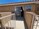 Balcony with white railings features a view of the red-tiled roof and neighboring unit at 8072 Cimarron Ridge Dr # 201, Las Vegas, NV 89128