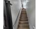A clean and bright staircase leading to the upper level of the home at 8072 Cimarron Ridge Dr # 201, Las Vegas, NV 89128